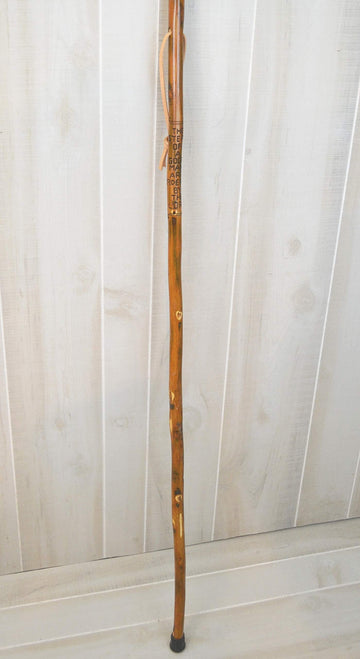 CreationCarvings handcrafted hardwood walking stick showcasing rustic charm.