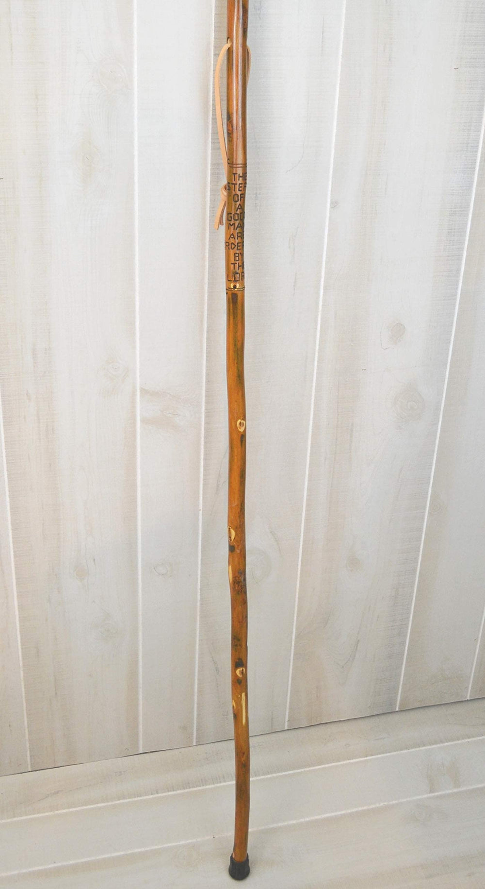 CreationCarvings handcrafted hardwood walking stick showcasing rustic charm.