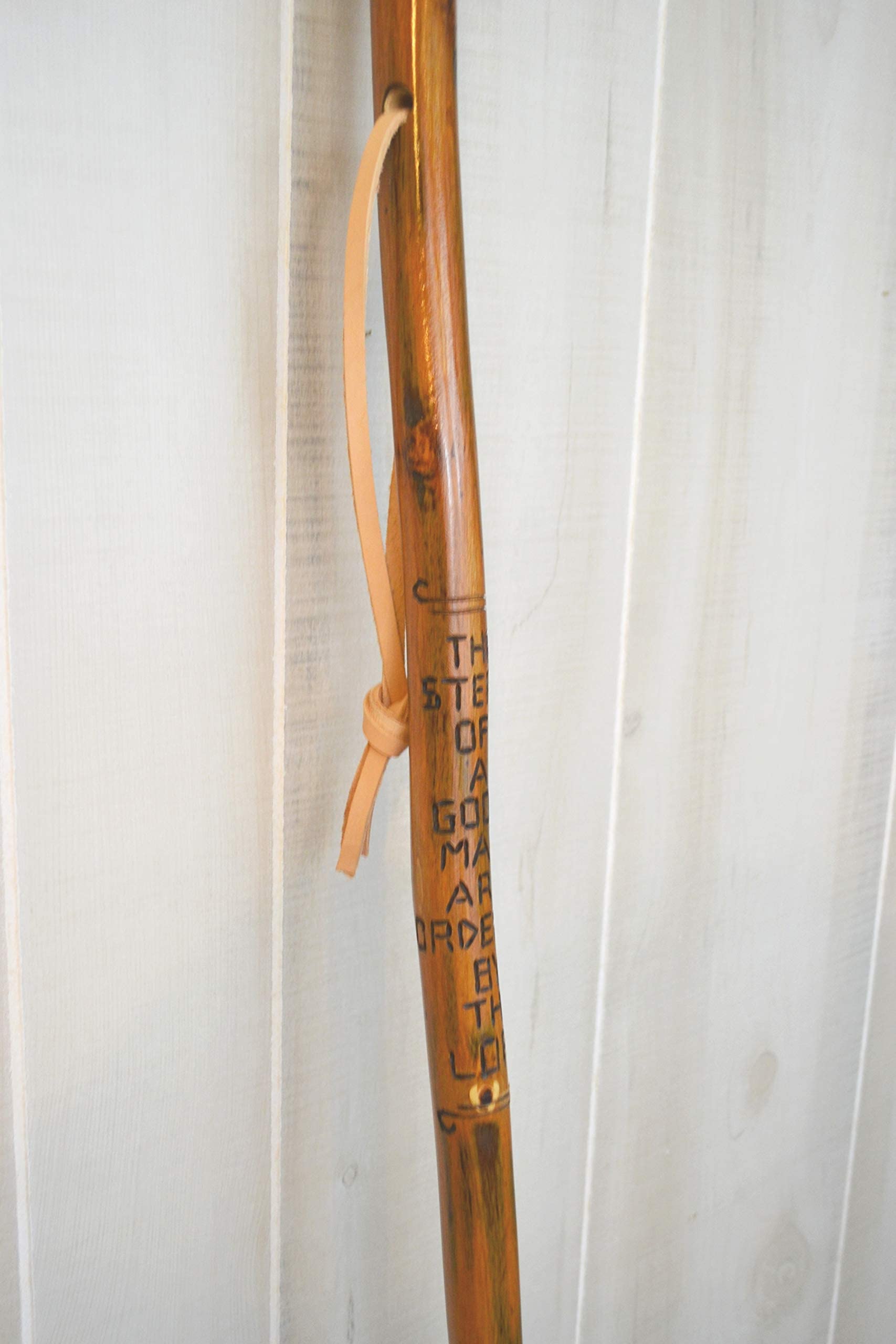 CreationCarvings hardwood walking stick natural finish highlights the wood grain.