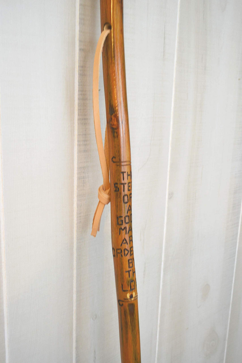 CreationCarvings hardwood walking stick natural finish highlights the wood grain.