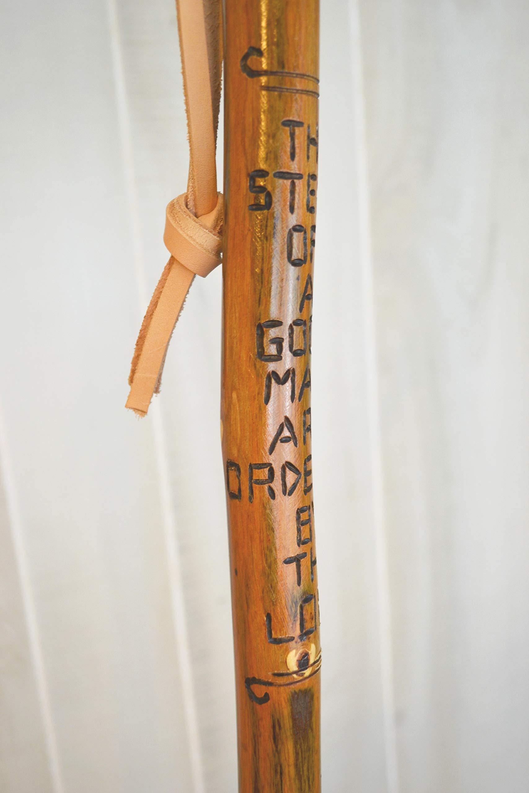 CreationCarvings hardwood walking stick with rubber tip for stable footing on trails.