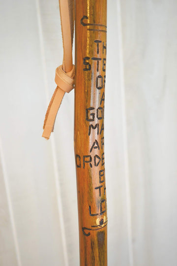 CreationCarvings hardwood walking stick with rubber tip for stable footing on trails.