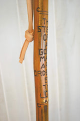CreationCarvings hardwood walking stick with rubber tip for stable footing on trails.