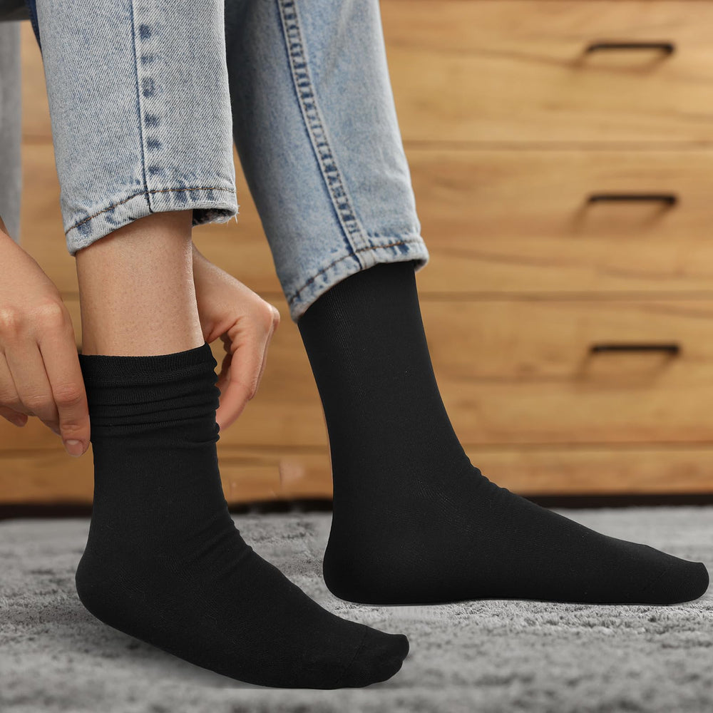 Croloose silk liner socks worn with hiking gear for comfort.