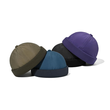 Lifestyle shot: Croogo visor-less sailor cap with packaging