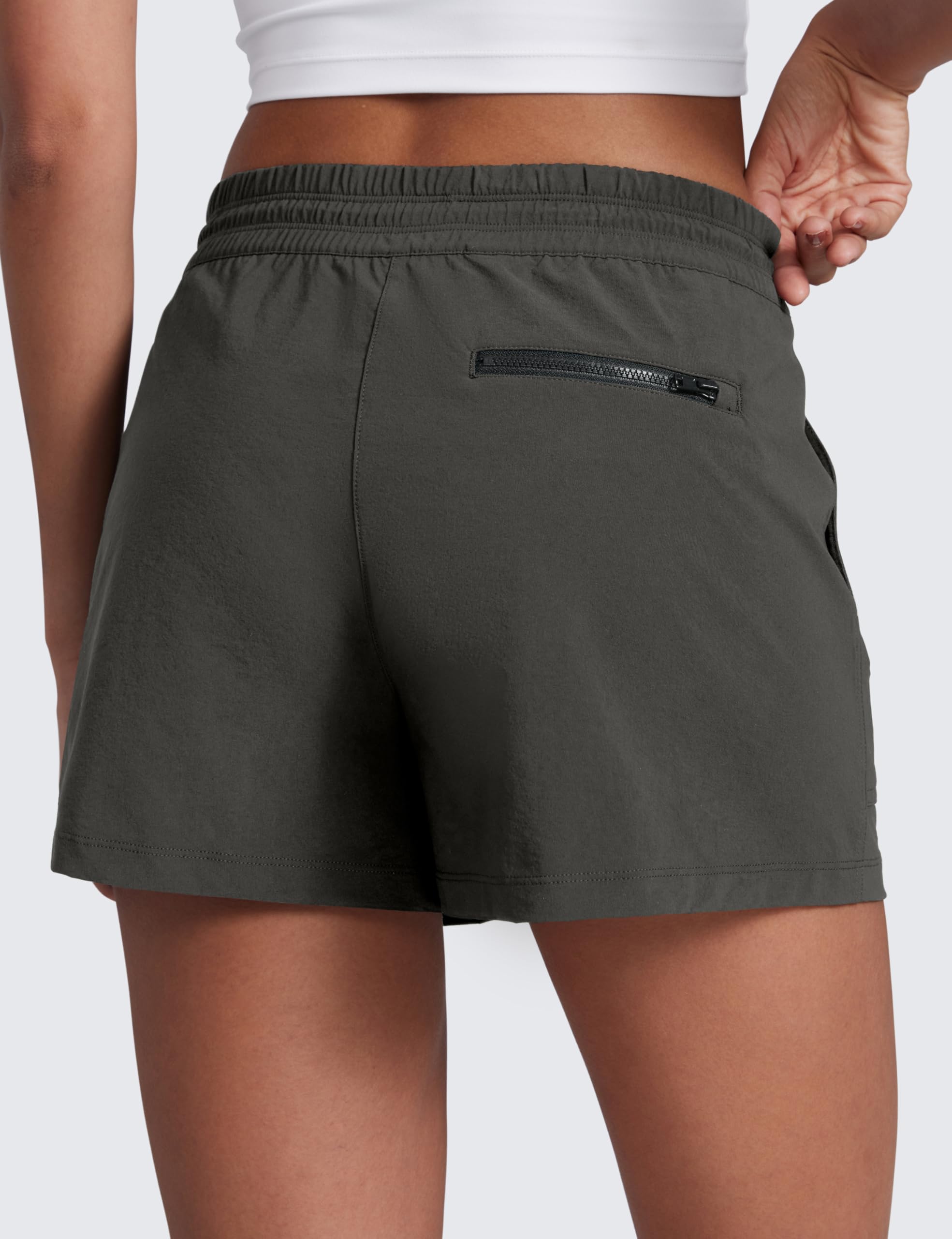 CRZ YOGA Arbor Olive 3-inch hiking shorts pocket zippers showing secure storage