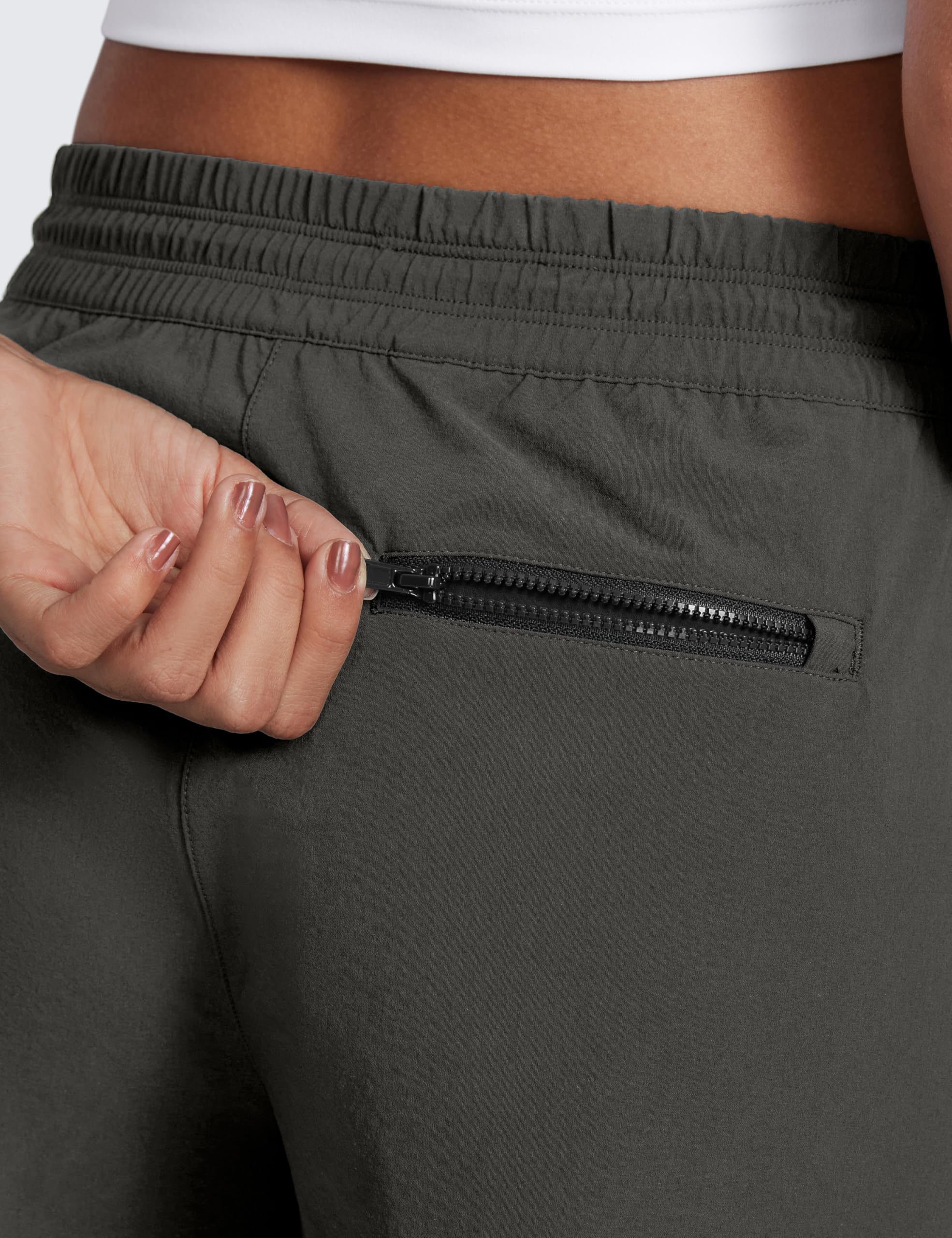 CRZ YOGA Arbor Olive 3-inch hiking shorts worn on trail highlight durability