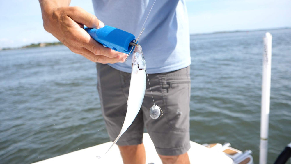 Cuda Bait Dehooker-lanyard-hole enables quick attachment on deck rails.