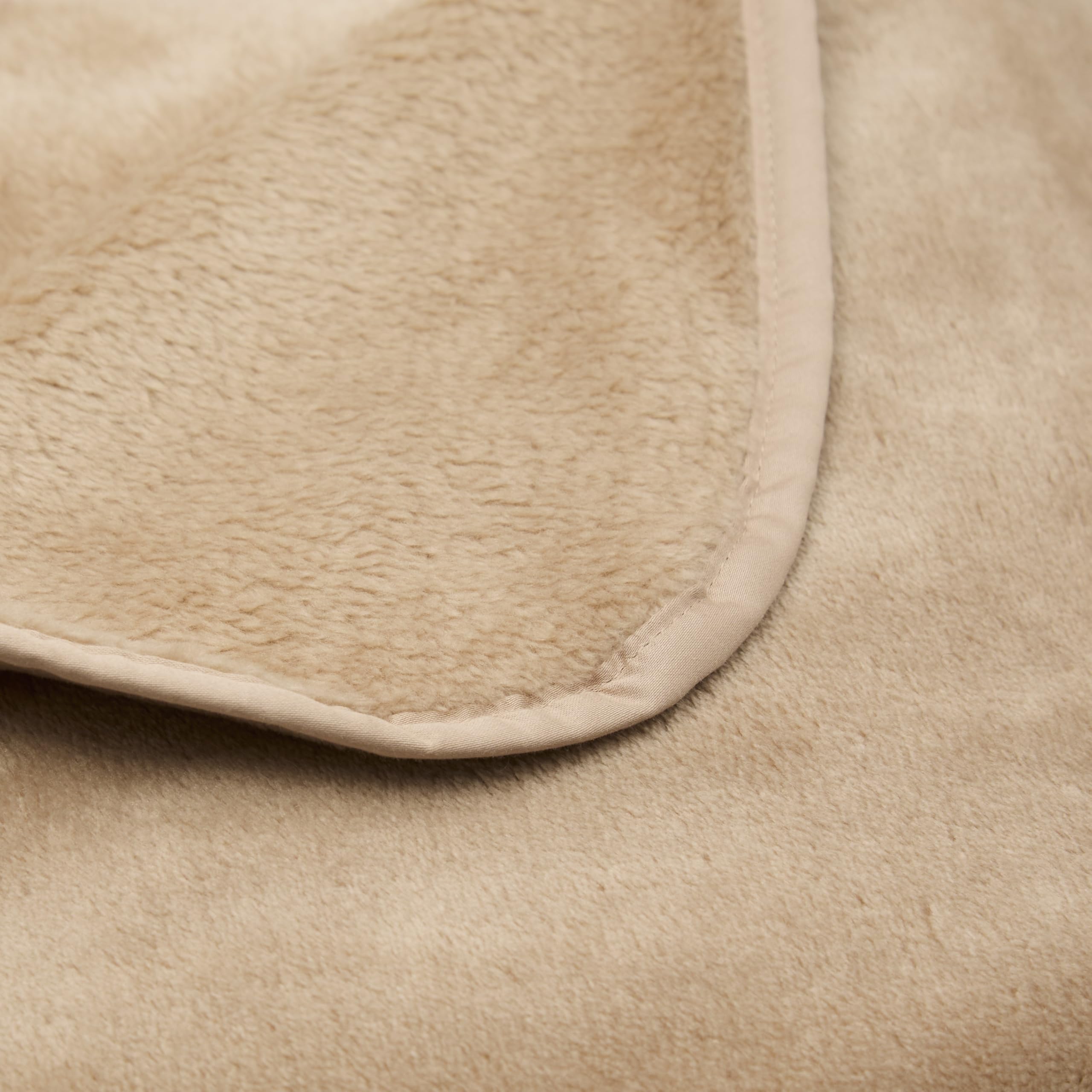 Cuddledown plush texture close-up highlights velvety softness and lightweight comfort