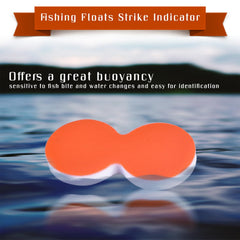 Bright orange strike indicators floating on water