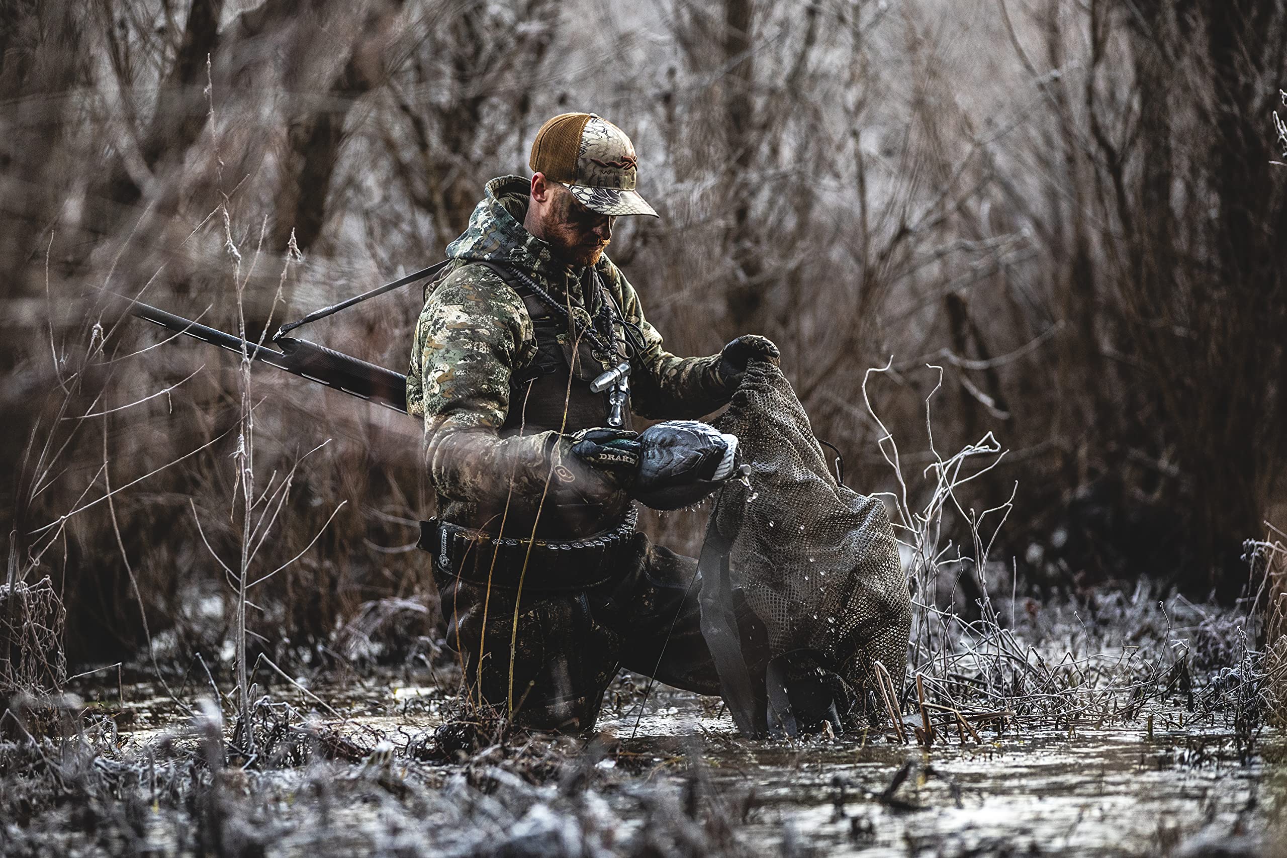 Cupped Waterfowl brown mesh bag blends with marsh surroundings
