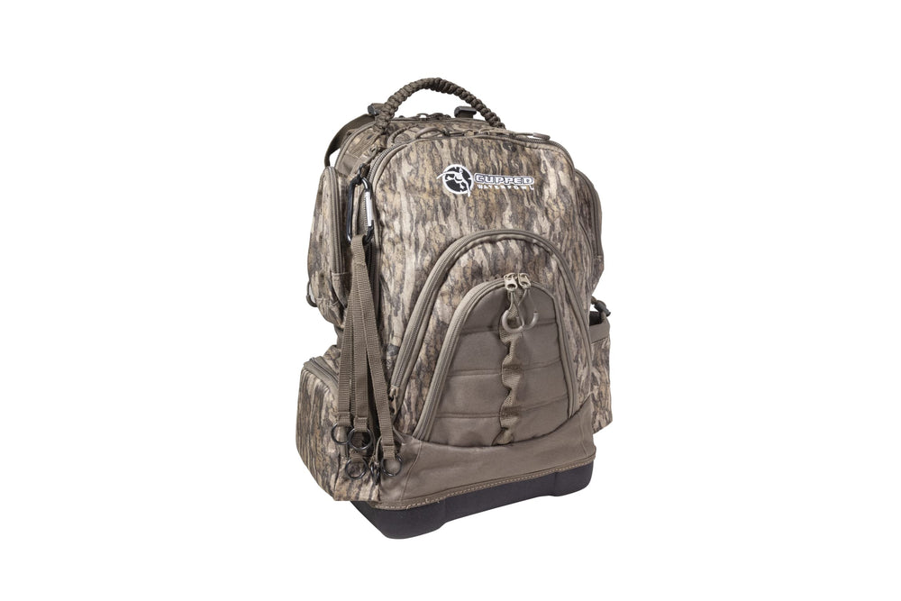Cupped Waterfowl pack highlights MOLLE loops for customizable storage.