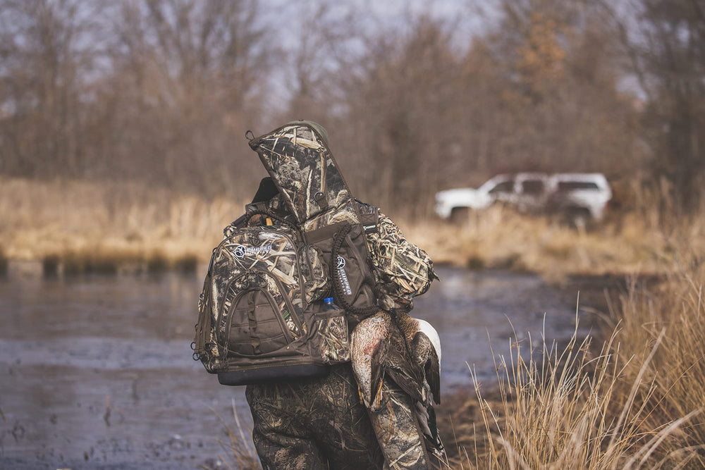 Cupped Waterfowl Padded-laptop-pocket guards electronics during transport through rugged fields.