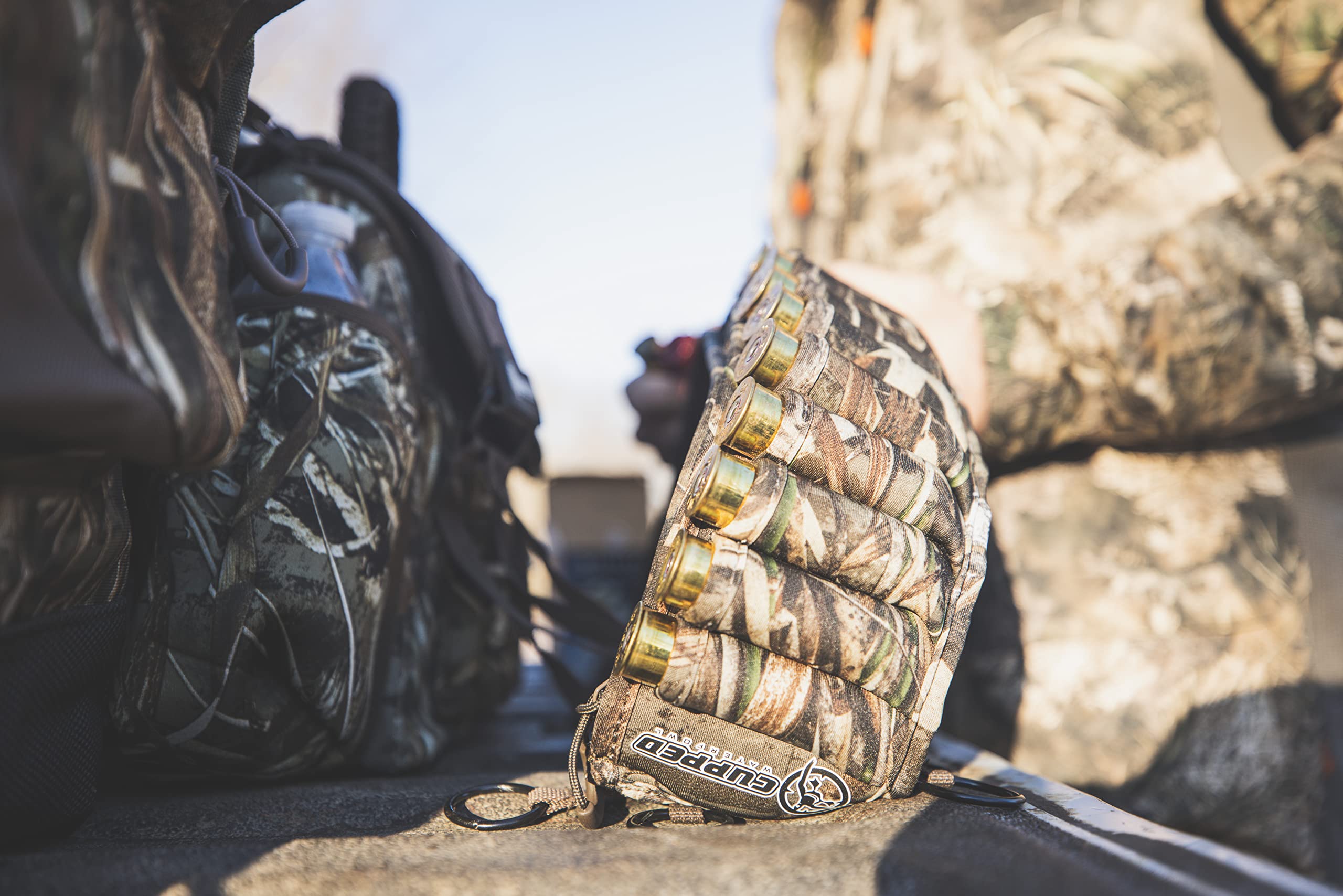 Cupped Waterfowl belt pocket stores choke tubes, small gear, snacks, or phone.