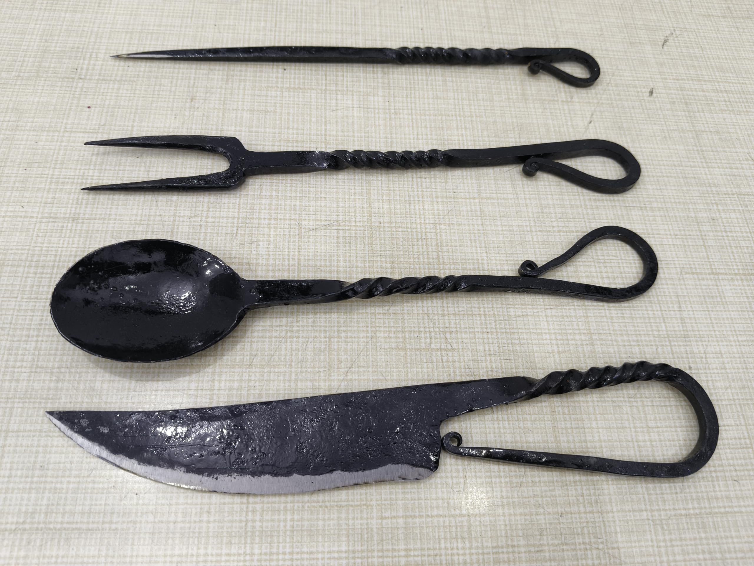Cutlery Set Knife cuts through meals with sturdy blade in rustic design.