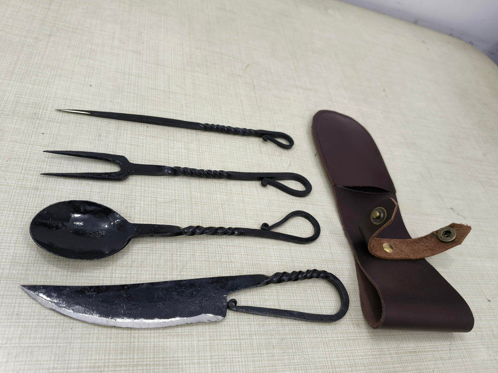 Cutlery Set Spoon and fork close-up highlights hand-forged texture and black finish.