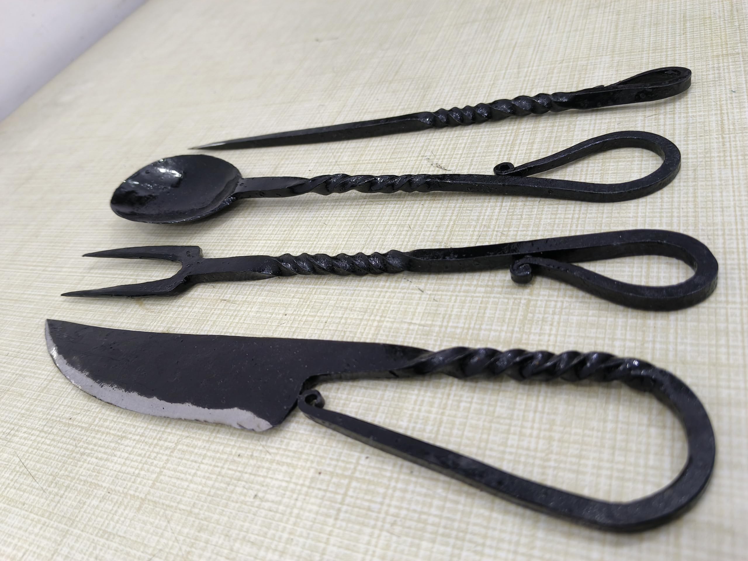 Cutlery Set Twisted Design iron utensils showcase rugged medieval craftsmanship.