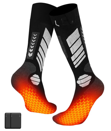 CYCYHEAT heated socks worn by an adult on skis for warmth.