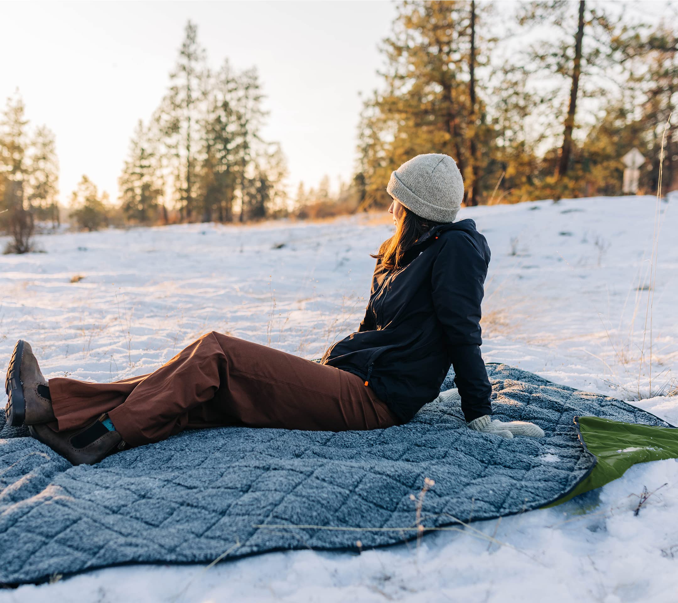 Dagmi Outdoors Sherpa Blanket on boat or travel setup suggests windproof warmth on the go