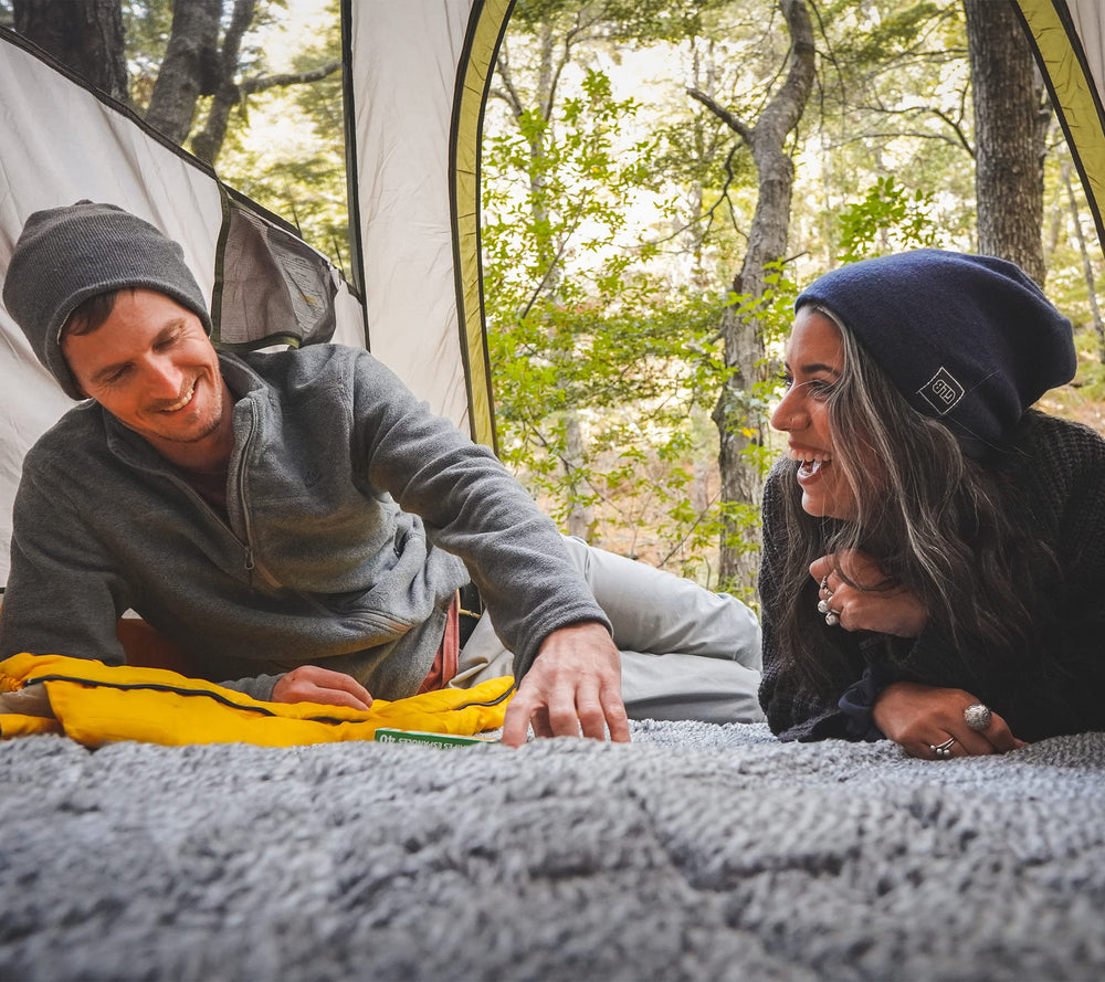 Dagmi Outdoors Sherpa Blanket on camping scene highlights lightweight 3.2 lb design