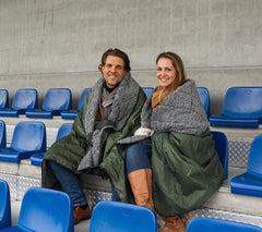 Dagmi Outdoors Sherpa Waterproof Blanket side view highlights waterproof layer guarding against rain while seated