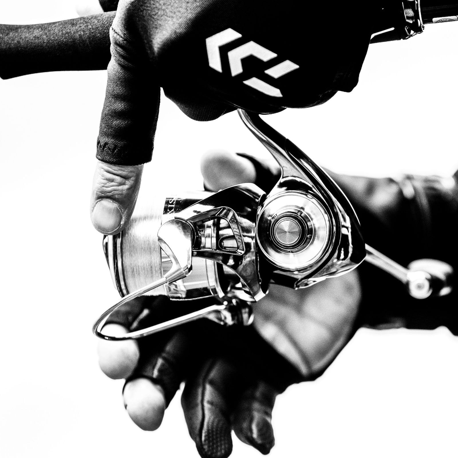 Daiwa Exist G LT spinning reel in black, rear view shows durable construction.
