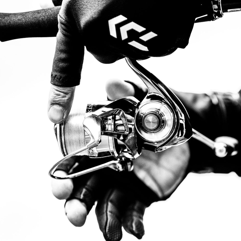 Daiwa Exist G LT spinning reel in black, rear view shows durable construction.