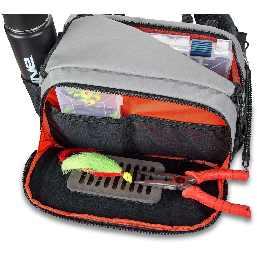 Dakine Mission Fish 12L waist pack secured for hands-free fishing