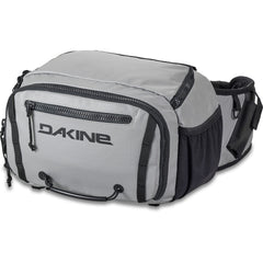 Dakine Mission Fish 12L waist pack worn for quick gear access on the shore