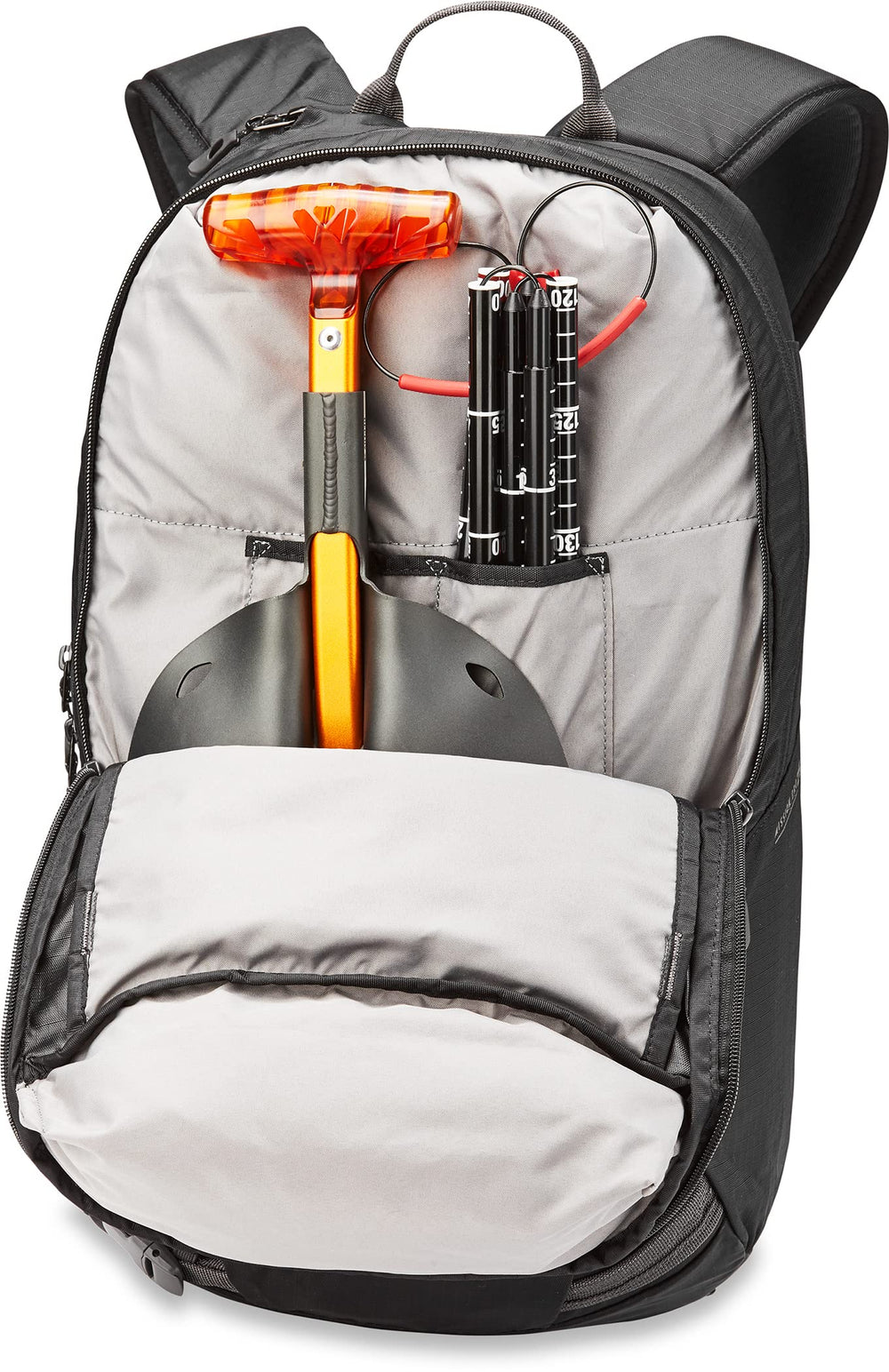 Dakine Mission Pro 25L shovel-probe pocket keeps essential tools organized