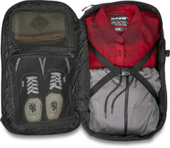 Dakine Split Adventure 38L laptop compartment demonstrates TSA-friendly organization for quick security checks.