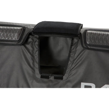 Four cinch straps with cam locks secure the pad to the tailgate