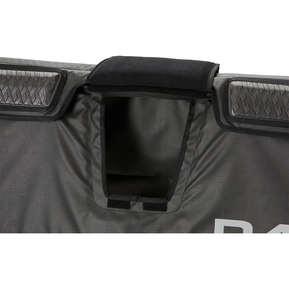 Four cinch straps with cam locks secure the pad to the tailgate