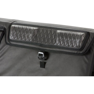 Dakine pad shows adjustable webbing anchor straps for secure fit