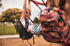 Dakine Youth Grom Pack Forest Friends sternum strap keeping straps secure on outdoor explorations