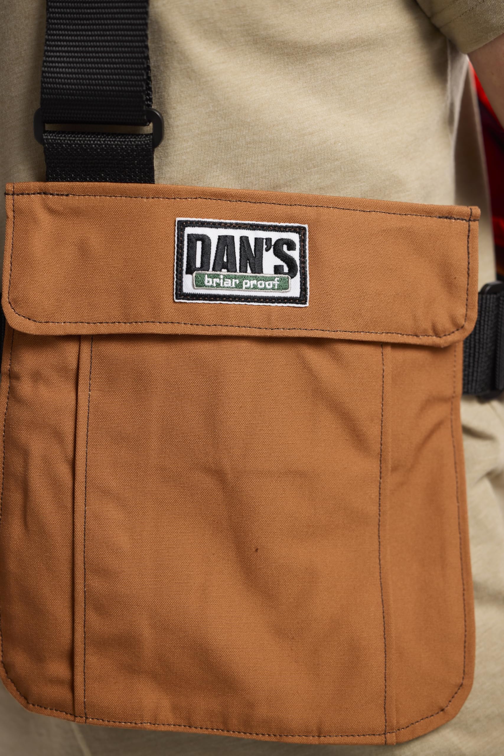DAN'S Hunting Gear Upland Strap Vest 300 sq in blaze orange area enhances safety.