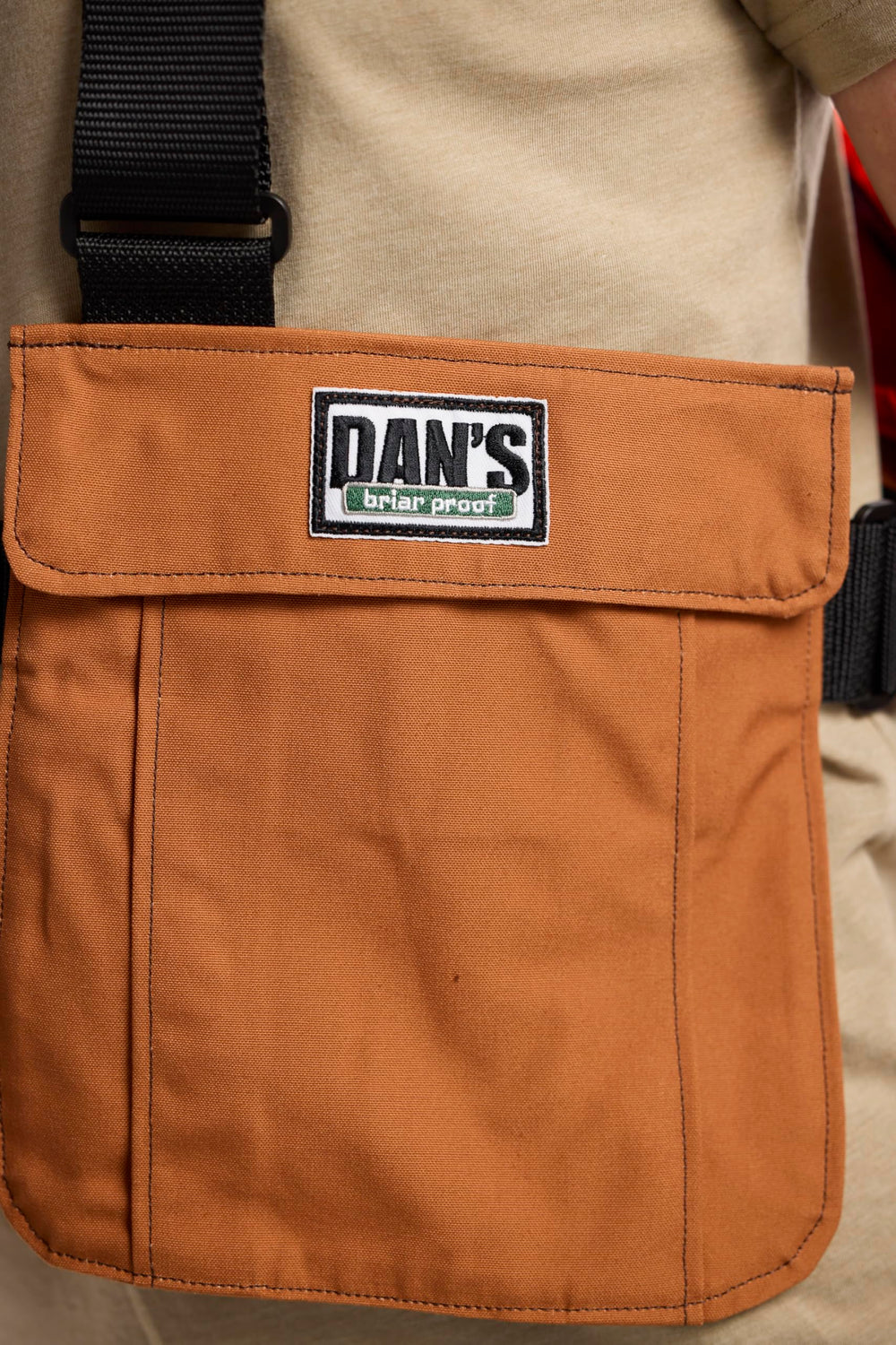 DAN'S Hunting Gear Upland Strap Vest 300 sq in blaze orange area enhances safety.