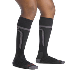 Darn Tough Edge Thermolite OTC over-the-calf sock worn with snow boots for alpine warmth.