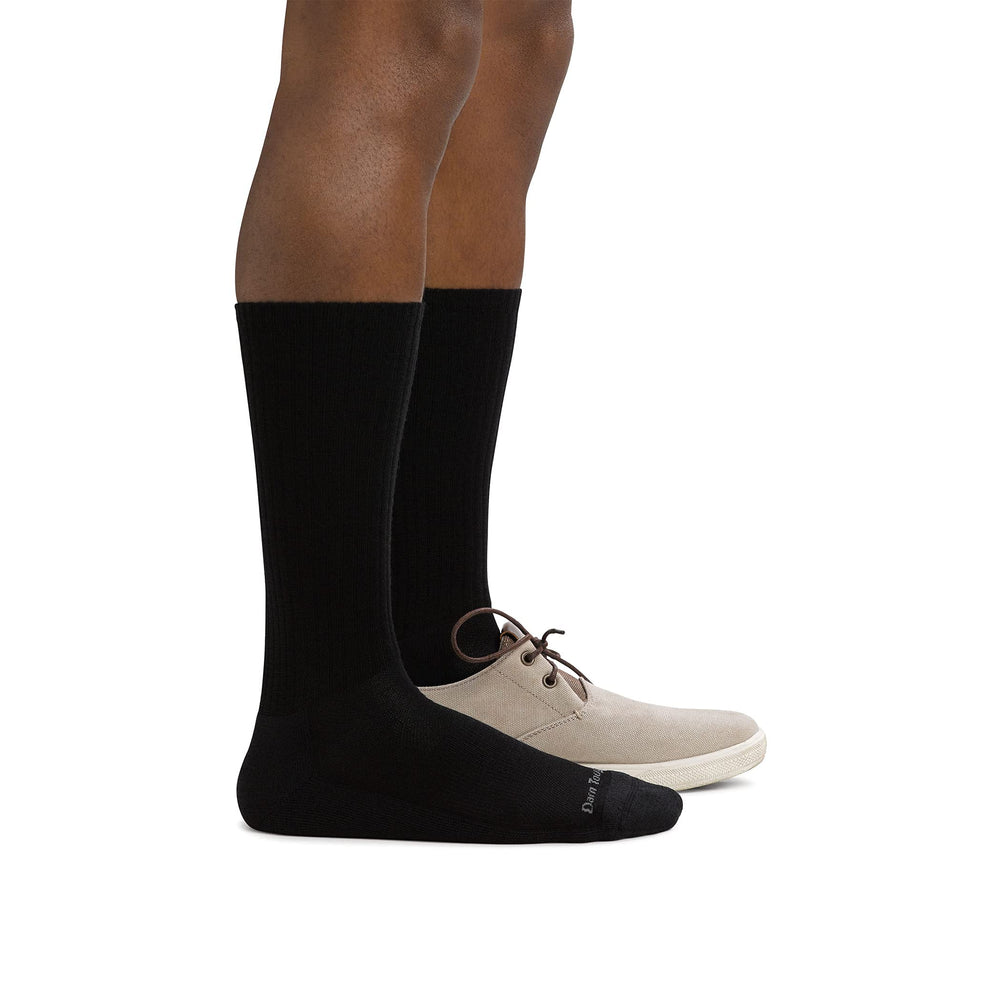 Darn Tough socks in black side view showing secure fit and seamless comfort.
