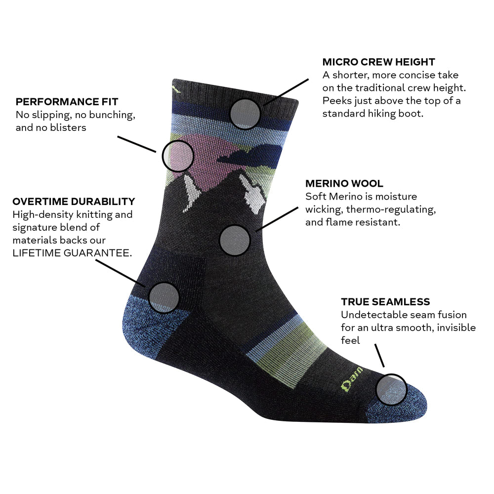 Darn Tough Sunset Ledge micro crew sock on foot highlights cushioned sole for stride support.
