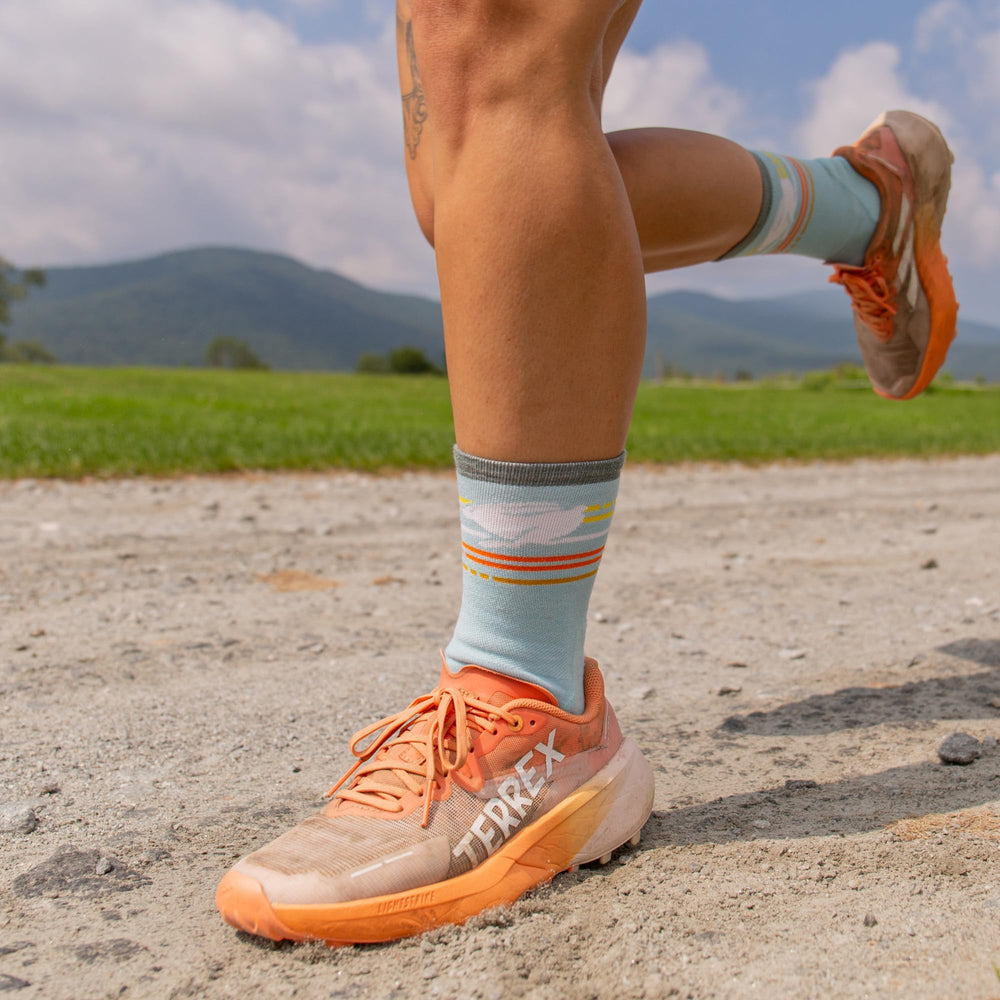 Darn Tough Vermont sock on foot in Glacier for cool, dry comfort.