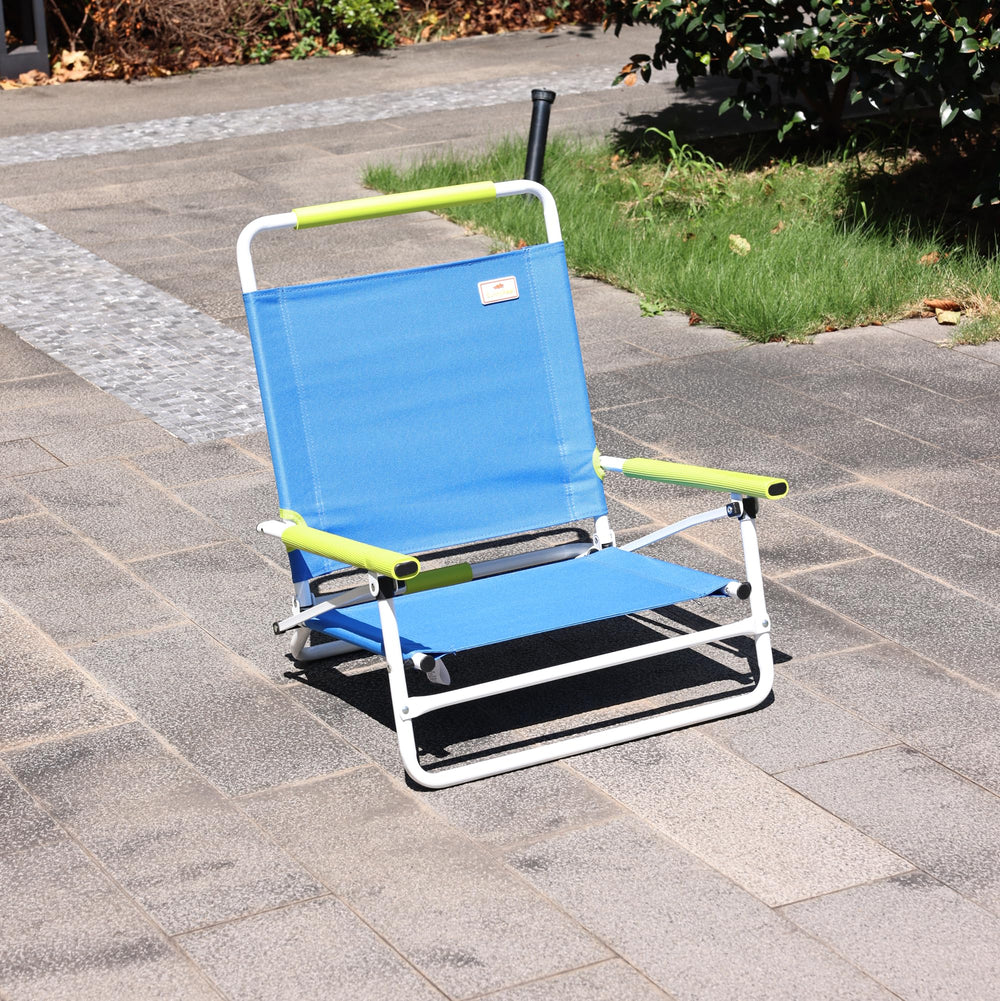 Daystar SunnyFeel chair on the beach demonstrates 300 lb weight capacity.