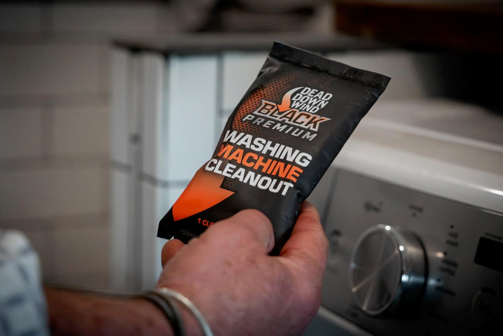DEAD DOWN WIND Black Premium Unscented Cleanout Pack closeup highlights compact formula for odor control.