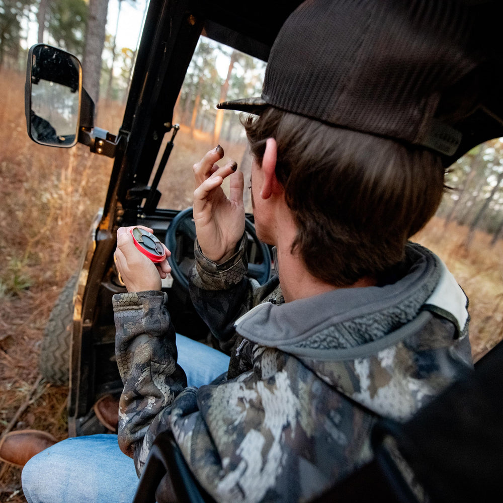 Dead Down Wind camo wheel in use on skin for quick odorless application.