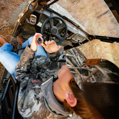 Dead Down Wind camo wheel being wiped clean for residue-free removal.
