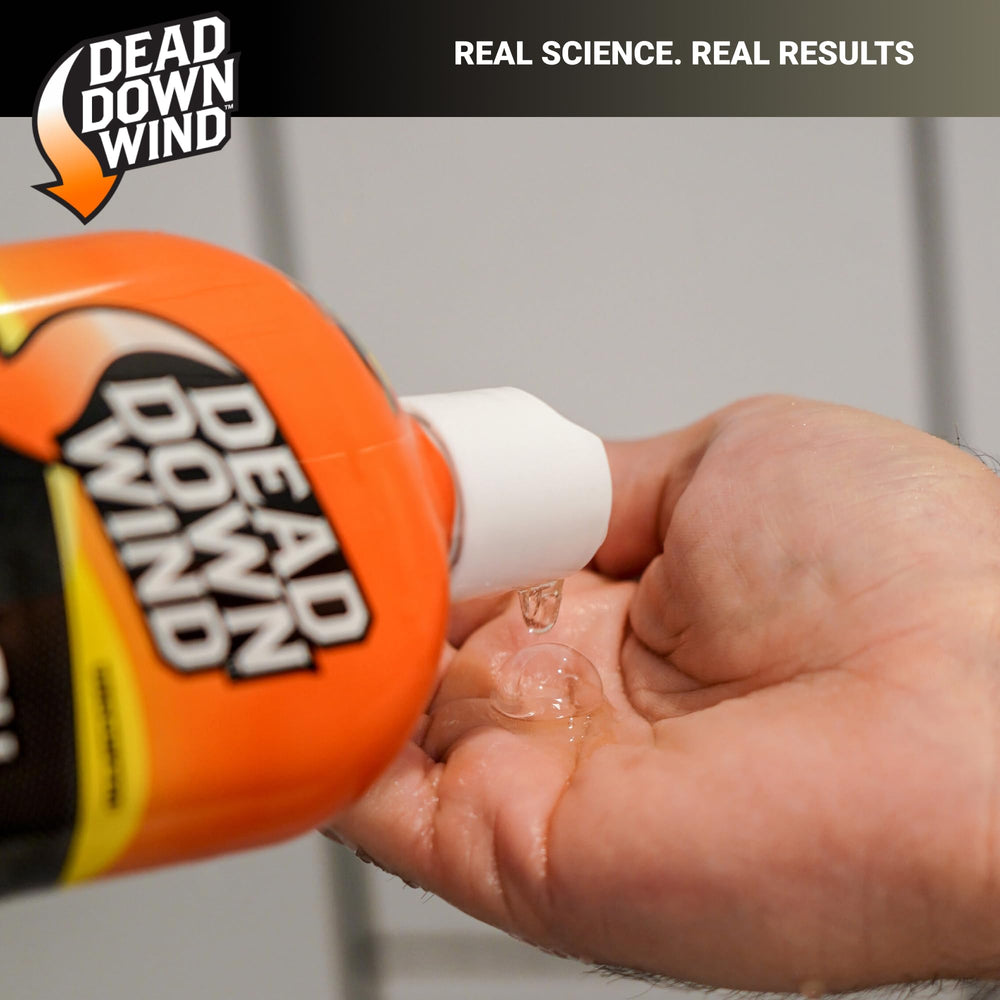 In-use shot of Dead Down Wind bottle highlighting odor-control benefits.