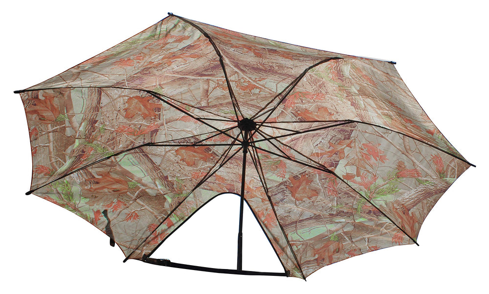 Dead Ringer Tree Stand Umbrella camo mounted to a tree shielding rain.