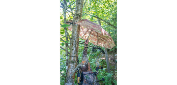 Dead Ringer Tree Stand Umbrella in camo blocks rain while you wait.