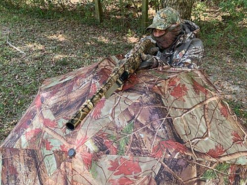 Dead Ringer camo umbrella fits tree stands for shade and rain relief.