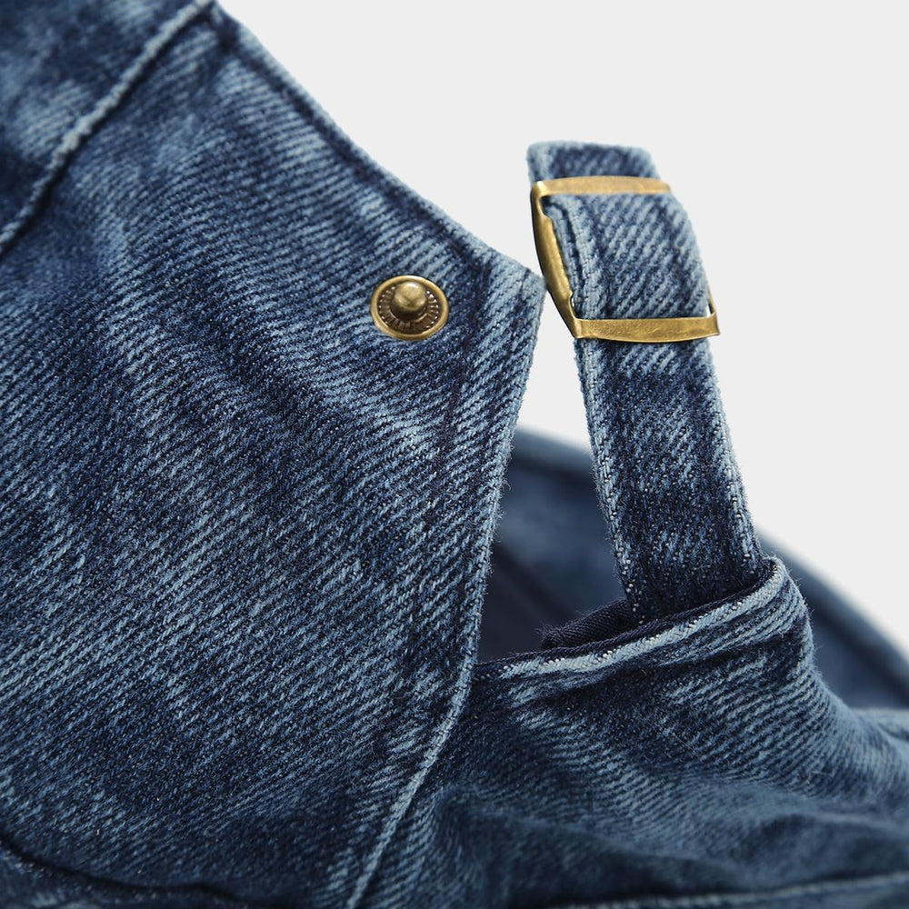 Lifestyle shot of denim newsboy cap suitable for driving and travel